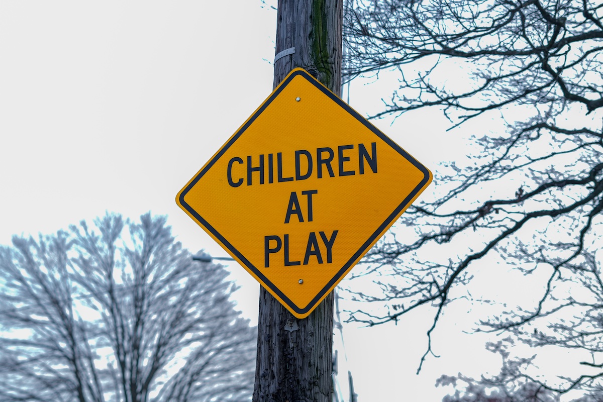 road sign reading "children at play"